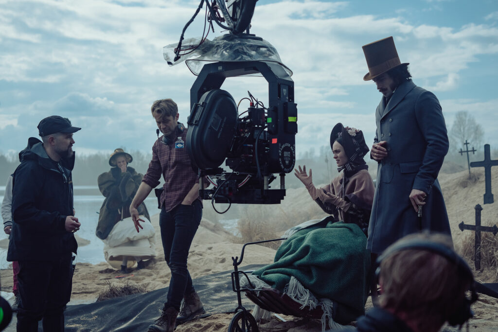 (L-R) Director Robert Eggers, actor Emma Corrin, director of photography Jarin Blaschke, and actors Lily-Rose Depp and Aaron Taylor-Johnson on the set of their film “Nosferatu.” Credit: Aidan Monaghan / © 2024 FOCUS FEATURES LLC