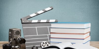 Set old books and Movies slate on the desk
