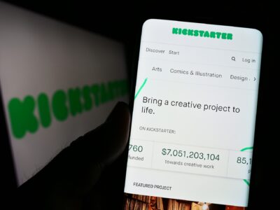Stuttgart, Germany - 01-13-2023: Person holding cellphone with webpage of US crowdfunding platform Kickstarter PBC on screen in front of logo. Focus on center of phone display. Unmodified photo.