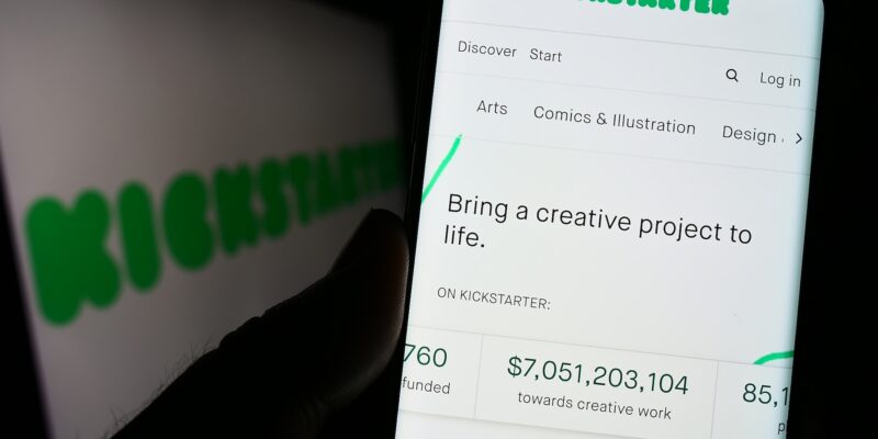 Stuttgart, Germany - 01-13-2023: Person holding cellphone with webpage of US crowdfunding platform Kickstarter PBC on screen in front of logo. Focus on center of phone display. Unmodified photo.