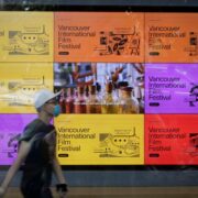 Vancouver, Canada. 25th Sep, 2020. A man walks past a digital billboard about the 39th Vancouver International Film Festival (VIFF) in Vancouver, British Columbia, Canada, Sept. 25, 2020. Featuring more than 100 films and events, the 39th VIFF is held from Sept. 24 till Oct. 7.