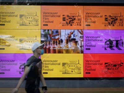 Vancouver, Canada. 25th Sep, 2020. A man walks past a digital billboard about the 39th Vancouver International Film Festival (VIFF) in Vancouver, British Columbia, Canada, Sept. 25, 2020. Featuring more than 100 films and events, the 39th VIFF is held from Sept. 24 till Oct. 7.