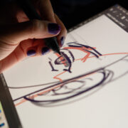 Animator designer drawing sketching development creating graphic pose characters, animation design studio. Caserta, Italy, July 22th 2021.