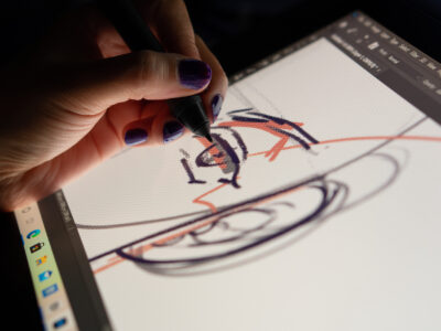 Animator designer drawing sketching development creating graphic pose characters, animation design studio. Caserta, Italy, July 22th 2021.