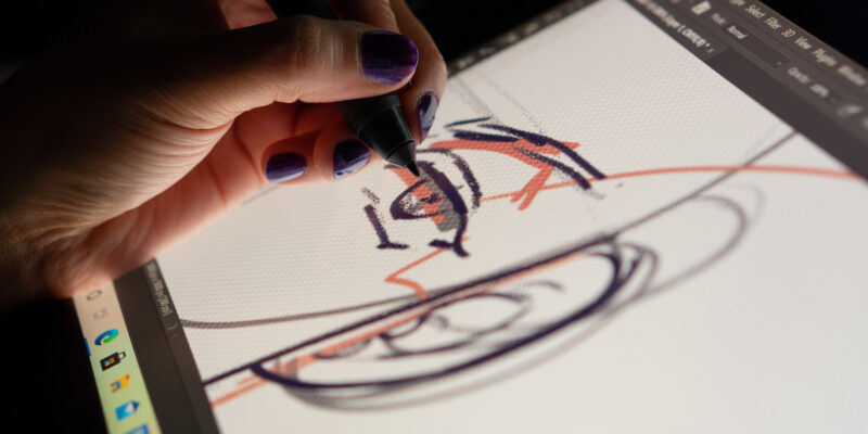 Animator designer drawing sketching development creating graphic pose characters, animation design studio. Caserta, Italy, July 22th 2021.