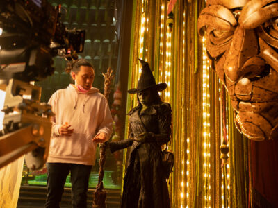 L to R: Director Jon M. Chu and Cynthia Erivo (as Elphaba) on the set of WICKED FOR GOOD, directed by Jon M. Chu.