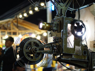 Bangkok,Thailand- Dec,2018: Retro festival, Thai people are watching movies through old film projector.