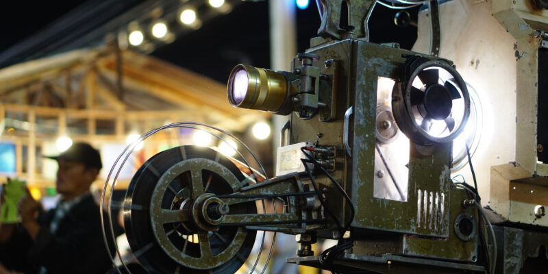 Bangkok,Thailand- Dec,2018: Retro festival, Thai people are watching movies through old film projector.
