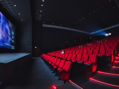 Russia, Nizhny Novgorod - may 23, 2014: Mir Cinema. Empty red cinema hall seats, chairs. Perspective view auditorium