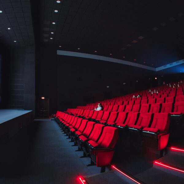 Russia, Nizhny Novgorod - may 23, 2014: Mir Cinema. Empty red cinema hall seats, chairs. Perspective view auditorium