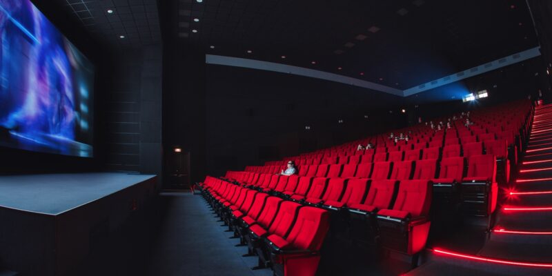 Russia, Nizhny Novgorod - may 23, 2014: Mir Cinema. Empty red cinema hall seats, chairs. Perspective view auditorium